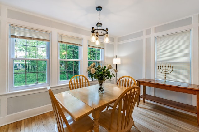 4 University Pl, Orono, ME 04473 - dining area with a chandelier, hardwood / wood-style floors, and baseboards