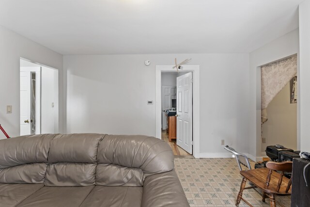 69 Stanford St, South Portland, ME 04106 - living room featuring baseboards and light flooring
