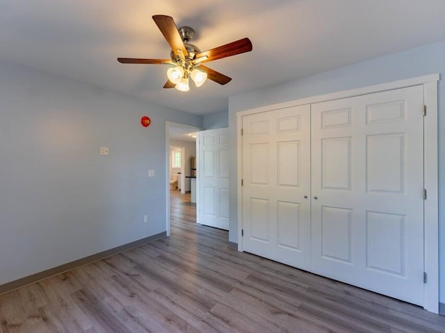 37 Bog Rd, Augusta, ME 04330 - unfurnished bedroom featuring wood finished floors, a closet, baseboards, and ceiling fan