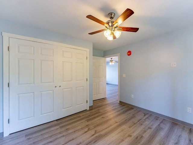 37 Bog Rd, Augusta, ME 04330 - unfurnished bedroom with light wood-type flooring, a closet, baseboards, and a ceiling fan