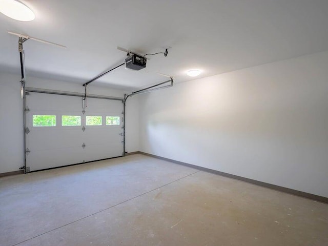 37 Bog Rd, Augusta, ME 04330 - garage featuring a garage door opener and baseboards
