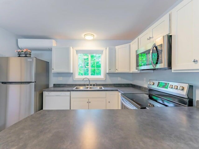 37 Bog Rd, Augusta, ME 04330 - kitchen featuring appliances with stainless steel finishes, a sink, dark countertops, and white cabinetry