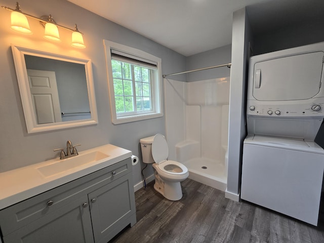 37 Bog Rd, Augusta, ME 04330 - full bath with stacked washer and clothes dryer, toilet, a shower, wood finished floors, and vanity