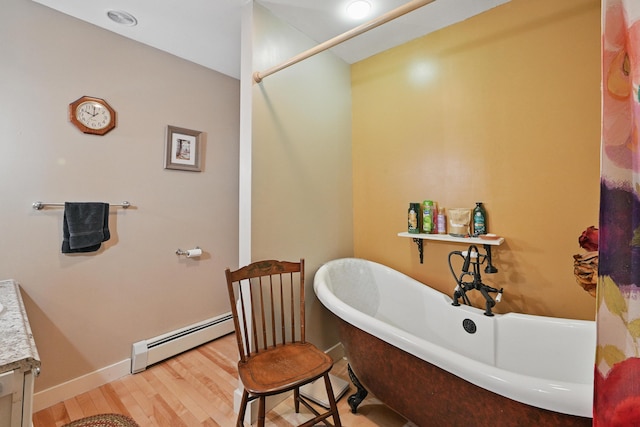 17 Lincoln Ln, Newcastle, ME 04553 - full bathroom with baseboard heating, wood finished floors, and a freestanding tub