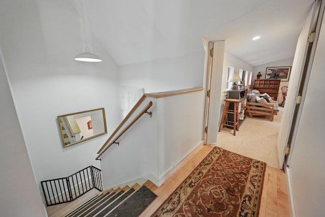 17 Lincoln Ln, Newcastle, ME 04553 - hallway with lofted ceiling, an upstairs landing, and light wood-style floors