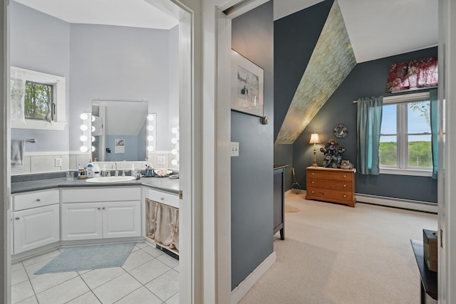 17 Lincoln Ln, Newcastle, ME 04553 - bathroom featuring a baseboard heating unit, healthy amount of natural light, vanity, vaulted ceiling, and tile patterned floors