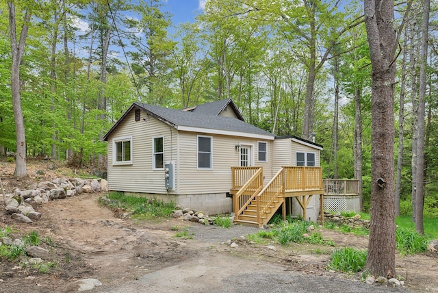 834-836 Sebago Rd, Sebago, ME 04029 - rear view of house featuring stairway, a wooden deck, and a shingled roof