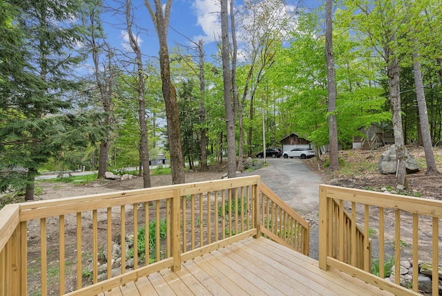 834-836 Sebago Rd, Sebago, ME 04029 - wooden terrace featuring driveway and view of scattered trees