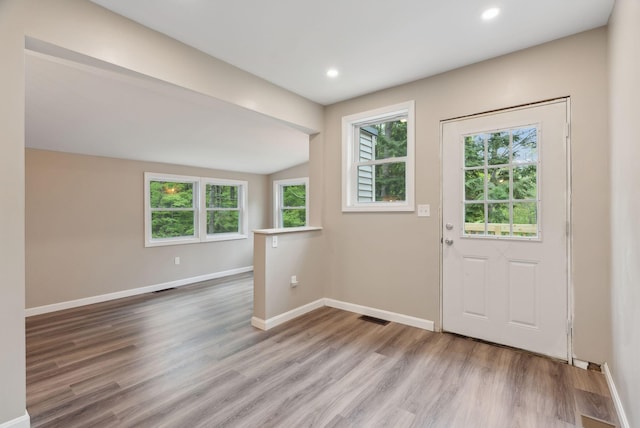 834-836 Sebago Rd, Sebago, ME 04029 - entryway with wood finished floors, baseboards, recessed lighting, and lofted ceiling