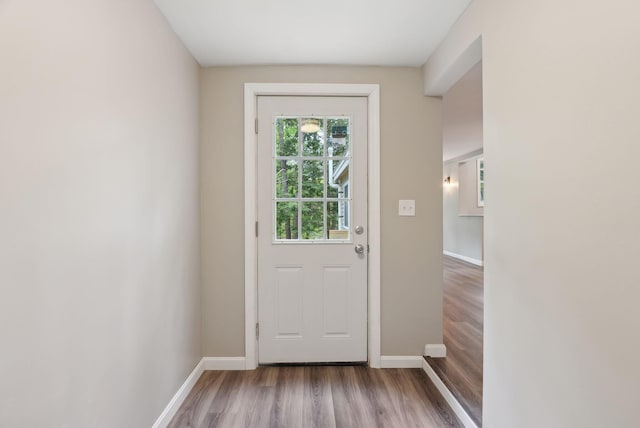 834-836 Sebago Rd, Sebago, ME 04029 - doorway featuring wood finished floors and baseboards