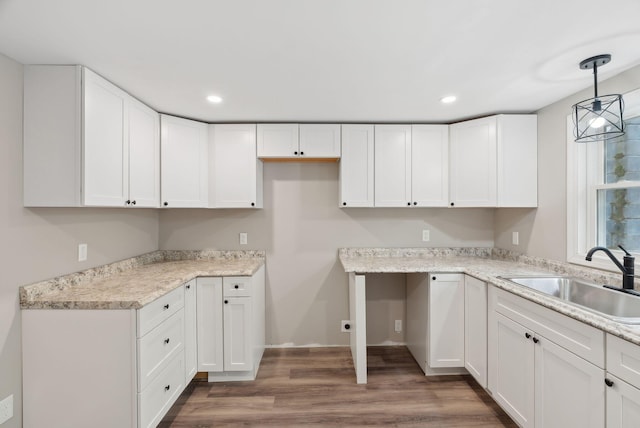 834-836 Sebago Rd, Sebago, ME 04029 - kitchen featuring a sink, white cabinets, wood finished floors, recessed lighting, and light countertops