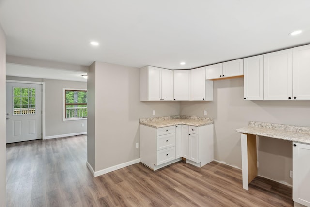 834-836 Sebago Rd, Sebago, ME 04029 - kitchen featuring light wood-type flooring, light stone counters, baseboards, white cabinets, and recessed lighting