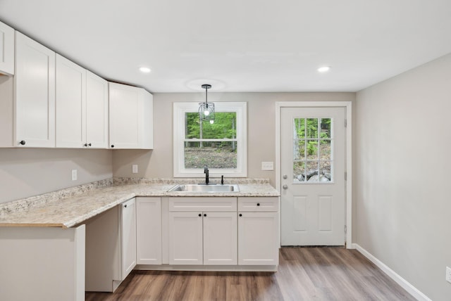 834-836 Sebago Rd, Sebago, ME 04029 - kitchen featuring a sink, light wood-type flooring, white cabinetry, recessed lighting, and baseboards