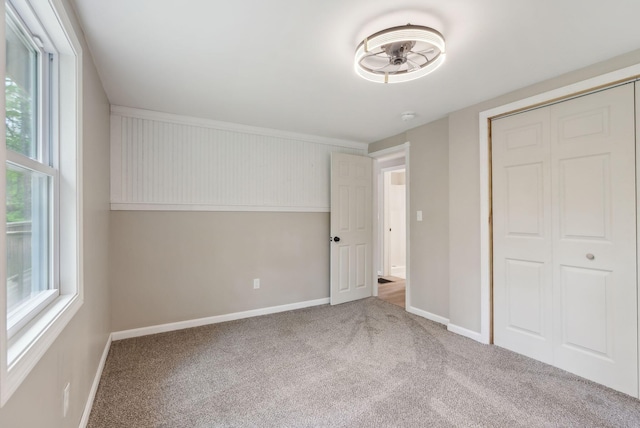 834-836 Sebago Rd, Sebago, ME 04029 - unfurnished bedroom with carpet flooring, baseboards, and a closet