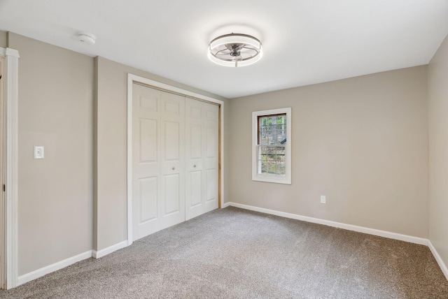 834-836 Sebago Rd, Sebago, ME 04029 - unfurnished bedroom featuring carpet floors, baseboards, and a closet