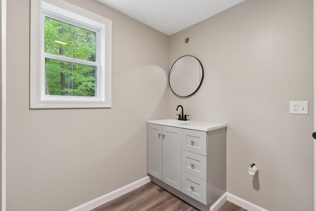 834-836 Sebago Rd, Sebago, ME 04029 - bathroom with vanity, wood finished floors, and baseboards
