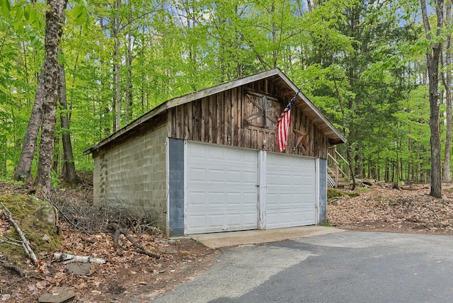 834-836 Sebago Rd, Sebago, ME 04029 - detached garage featuring a forest view