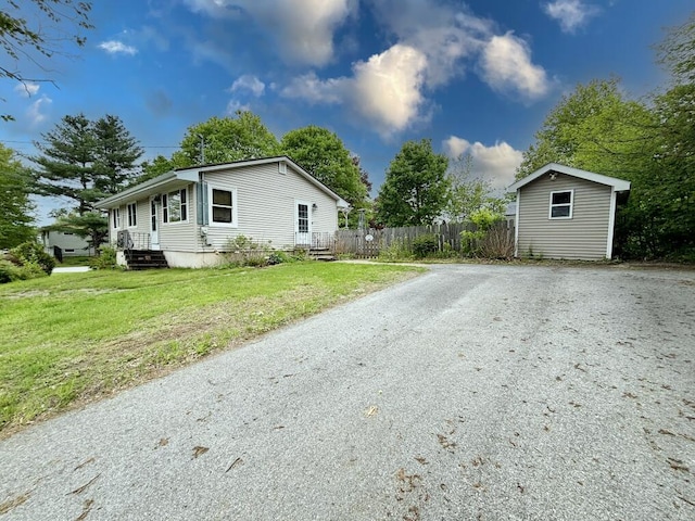 24 Mitchell St, Lewiston, ME 04240 - view of side of property featuring gravel driveway