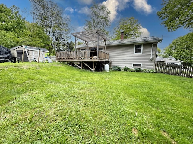 24 Mitchell St, Lewiston, ME 04240 - back of house featuring a pergola, a chimney, a standing seam roof, a wooden deck, and metal roof