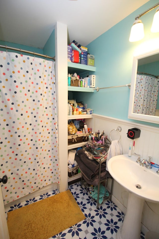 24 Mitchell St, Lewiston, ME 04240 - bathroom featuring a shower with curtain, a sink, and tile patterned floors