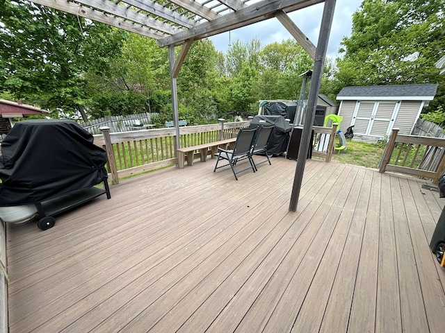 24 Mitchell St, Lewiston, ME 04240 - wooden terrace featuring a pergola, view of wooded area, and grilling area