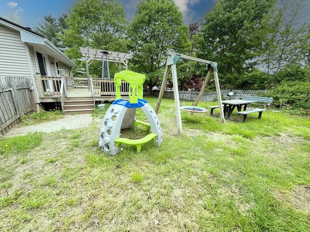 24 Mitchell St, Lewiston, ME 04240 - view of yard with a playground, a wooden deck, a pergola, and view of scattered trees