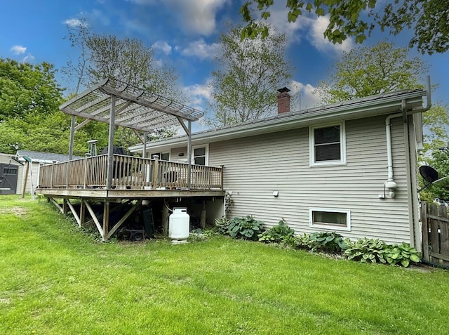 24 Mitchell St, Lewiston, ME 04240 - rear view of house with a wooden deck, a chimney, and a pergola