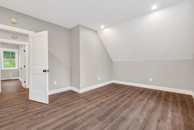 61 Main Rd, Eddington, ME 04428 - additional living space featuring a baseboard heating unit, baseboards, wood finished floors, vaulted ceiling, and recessed lighting