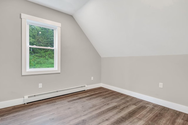 61 Main Rd, Eddington, ME 04428 - additional living space with baseboard heating, lofted ceiling, wood finished floors, and baseboards