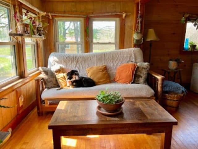 634 N Rd, Mount Chase, ME 04765 - living area with wooden walls and light wood-style flooring