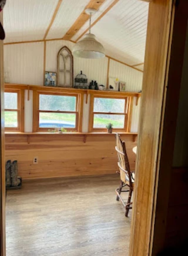634 N Rd, Mount Chase, ME 04765 - unfurnished office with wood-type flooring, healthy amount of natural light, wooden walls, and lofted ceiling