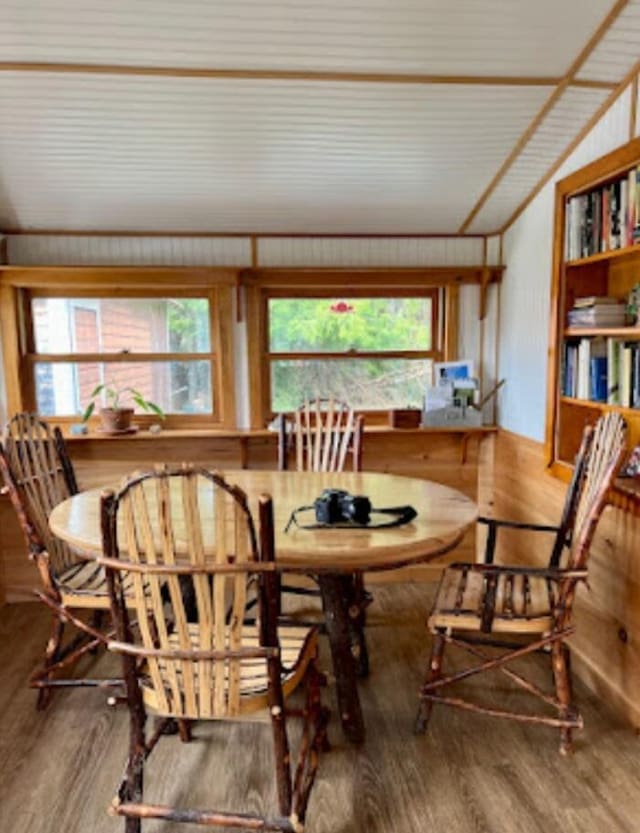 634 N Rd, Mount Chase, ME 04765 - dining space with lofted ceiling, wood finished floors, and healthy amount of natural light