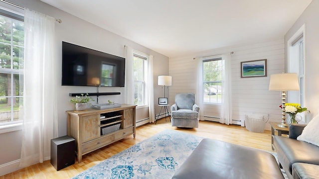 53 Gray Rd, Gorham, ME 04038 - living room with a baseboard heating unit and light wood finished floors