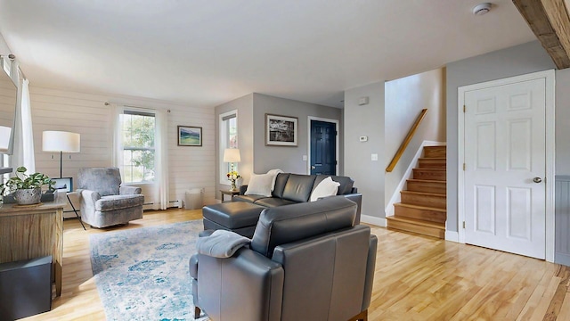 53 Gray Rd, Gorham, ME 04038 - living area with light wood-style floors, stairway, and a baseboard heating unit
