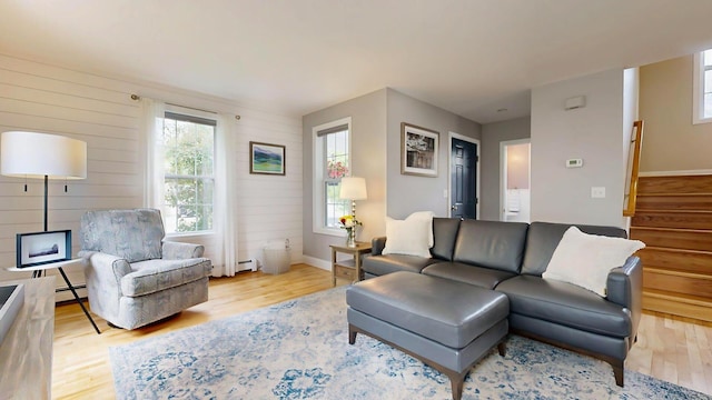 53 Gray Rd, Gorham, ME 04038 - living area with wood finished floors, stairway, and healthy amount of natural light