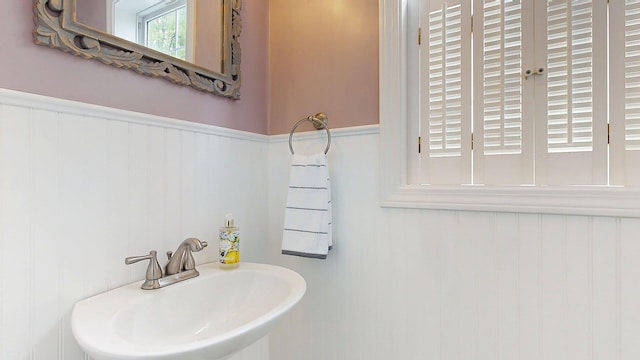 53 Gray Rd, Gorham, ME 04038 - bathroom featuring a sink and a wainscoted wall