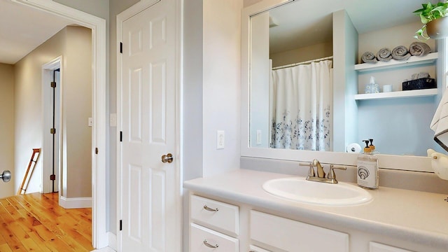 53 Gray Rd, Gorham, ME 04038 - full bath with vanity, wood finished floors, and a shower with curtain