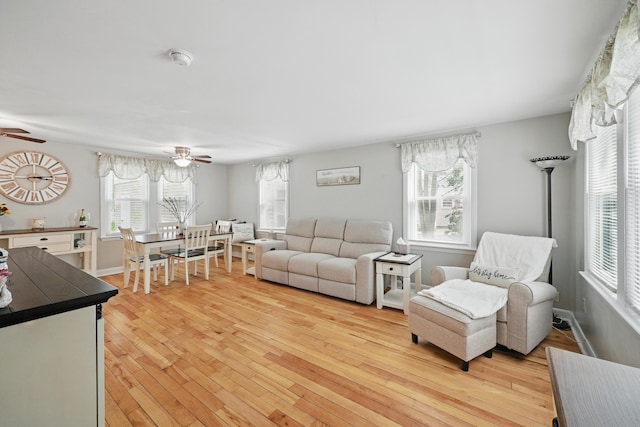 29 Emanual Dr, Brunswick, ME 04011 - living area featuring ceiling fan, plenty of natural light, and light wood-style floors