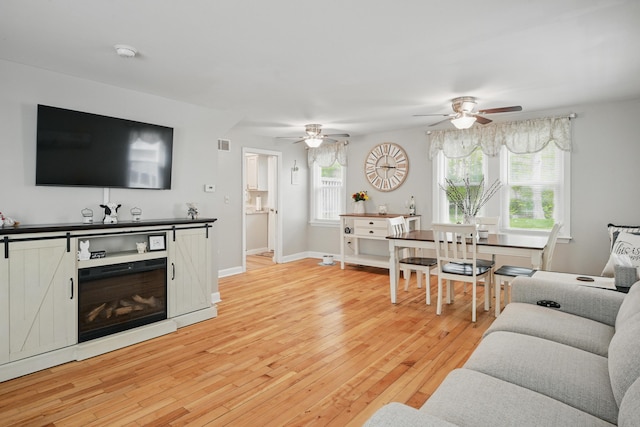29 Emanual Dr, Brunswick, ME 04011 - living area with ceiling fan, light wood-style flooring, and baseboards