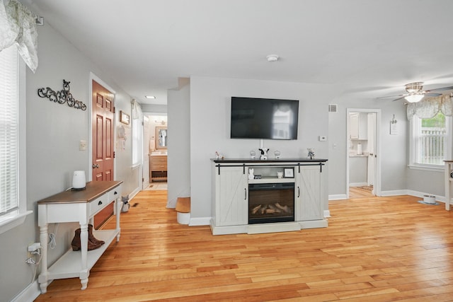 29 Emanual Dr, Brunswick, ME 04011 - living room with light wood-style flooring, ceiling fan, and baseboards