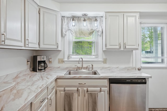 29 Emanual Dr, Brunswick, ME 04011 - kitchen featuring dishwasher, a sink, white cabinets, light countertops, and plenty of natural light