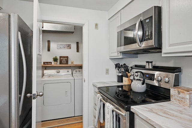 29 Emanual Dr, Brunswick, ME 04011 - kitchen featuring appliances with stainless steel finishes, separate washer and dryer, and white cabinetry