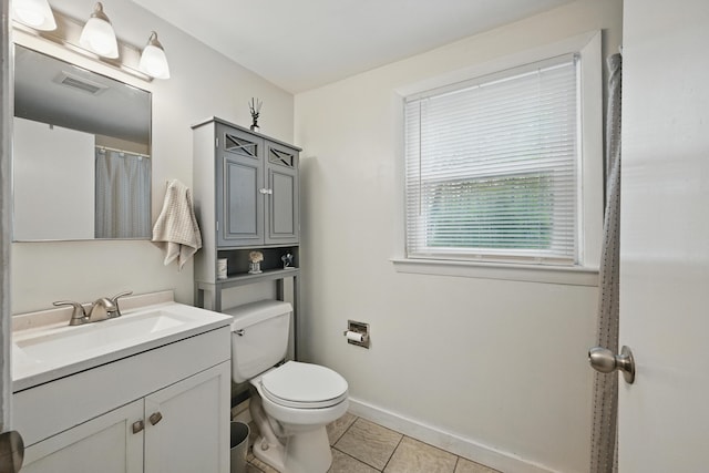 29 Emanual Dr, Brunswick, ME 04011 - bathroom with vanity, toilet, tile patterned flooring, and baseboards
