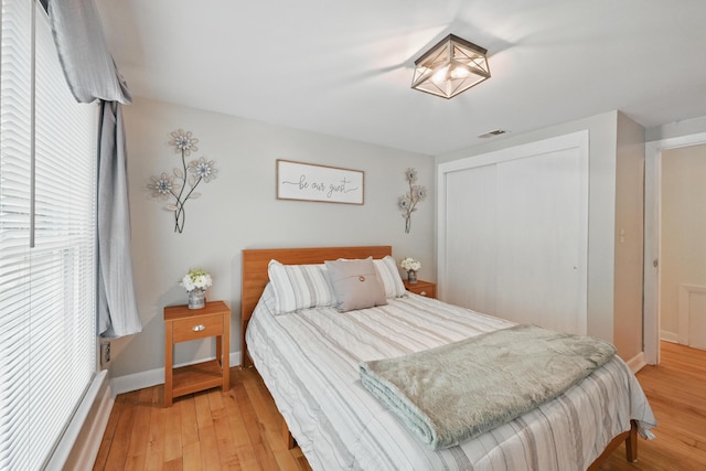 29 Emanual Dr, Brunswick, ME 04011 - bedroom featuring a closet, light wood-type flooring, and baseboards