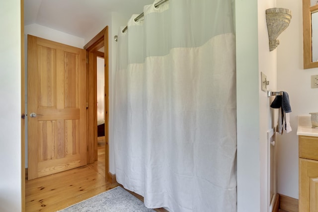 241 Old Stage Rd, Arrowsic, ME 04530 - bathroom with wood finished floors, vanity, and curtained shower