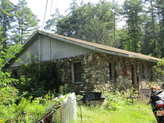 33 Log N Rock Rd, Eliot, ME 03442 - view of side of property featuring stone siding