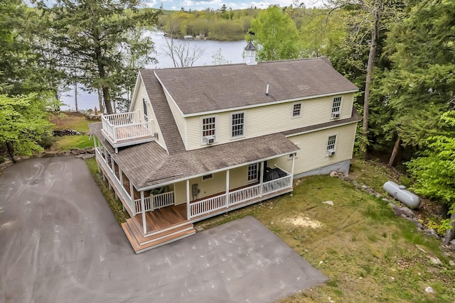 700 Pond Rd, Saint Albans, ME 04971 - back of house featuring covered porch, a shingled roof, and a water view