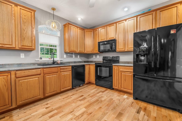 700 Pond Rd, Saint Albans, ME 04971 - kitchen featuring black appliances, a sink, light wood finished floors, decorative light fixtures, and recessed lighting