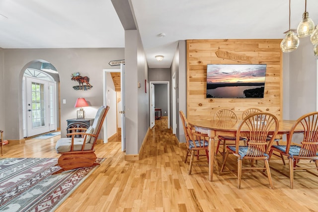 700 Pond Rd, Saint Albans, ME 04971 - dining room featuring arched walkways, light wood-type flooring, and baseboards