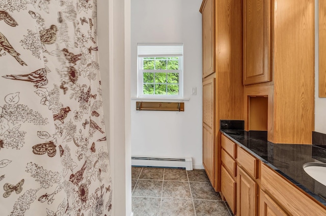 700 Pond Rd, Saint Albans, ME 04971 - full bath with a baseboard heating unit, vanity, curtained shower, and baseboards
